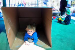 Beverly Montessori child playing in a box