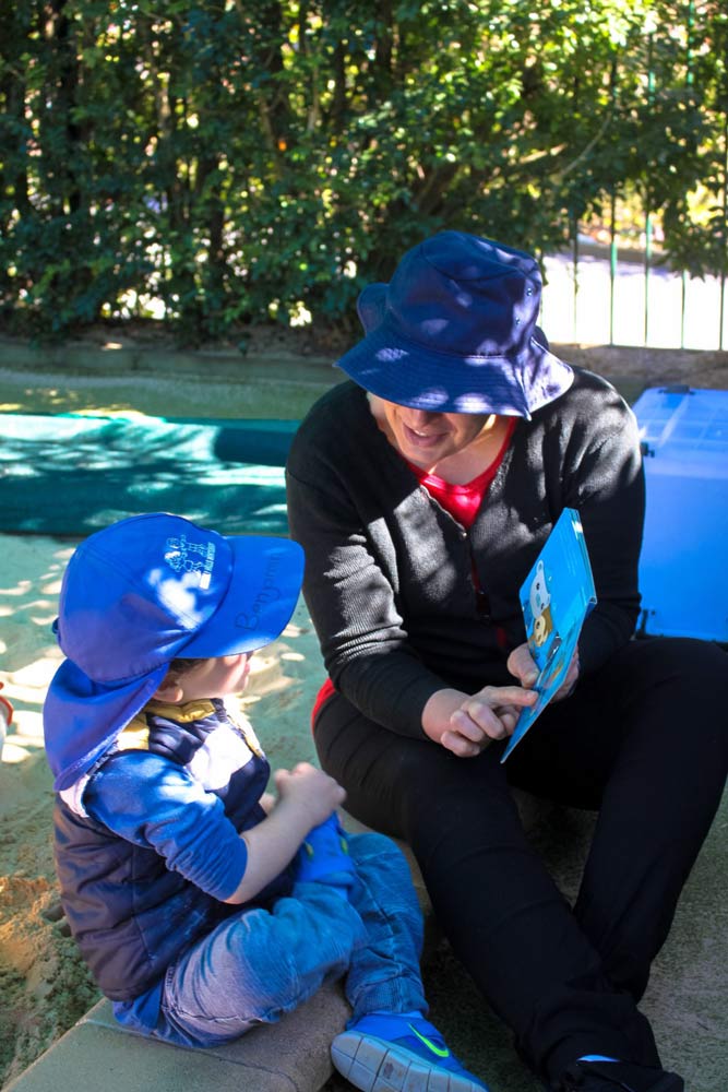 Beverly Montessori child reading with teacher